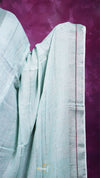 Light blue saree with red border on a purple background