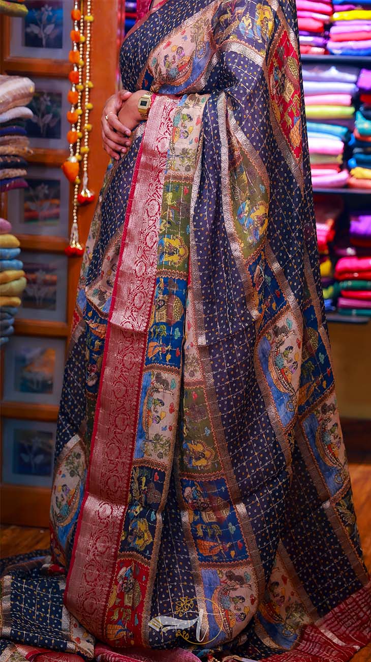 Person wearing a colorful patchwork dress in a fabric store.