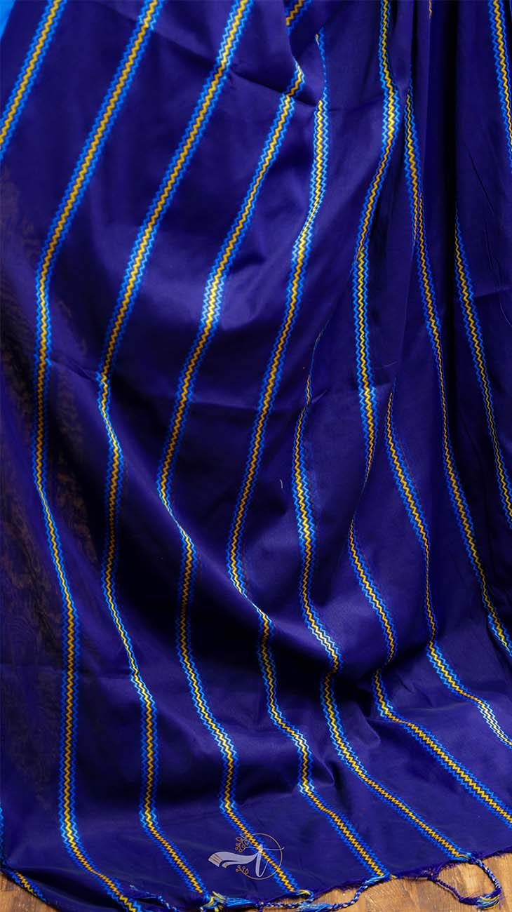 Close-up of a blue fabric with gold stripes