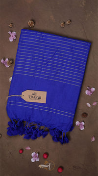 Blue towel with tassels on a brown background with decorative elements