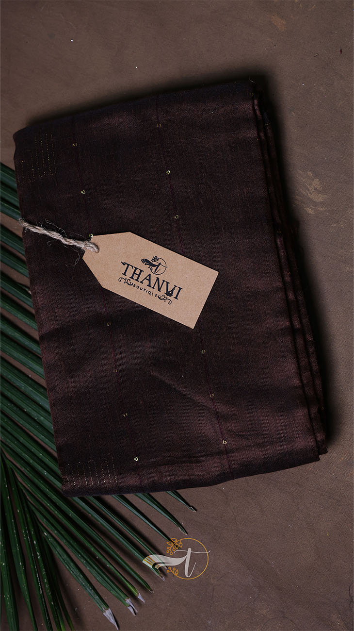 Brown fabric with a tag on a dark background
