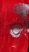 Red fabric with silver floral embroidery