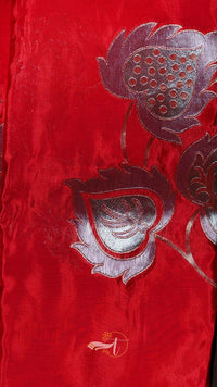 Red fabric with silver floral embroidery
