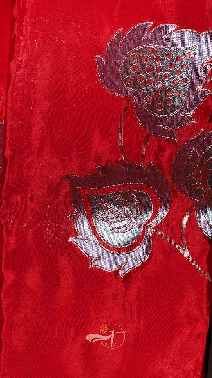 Red fabric with silver floral embroidery
