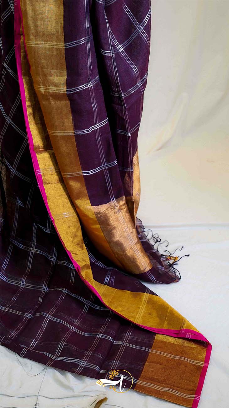 Saree with purple and gold checkered pattern on a white background