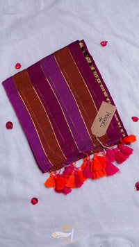 Striped fabric with tassels and a brand tag on a white background