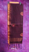 Brown scarf with decorative patterns and tassels on a purple background
