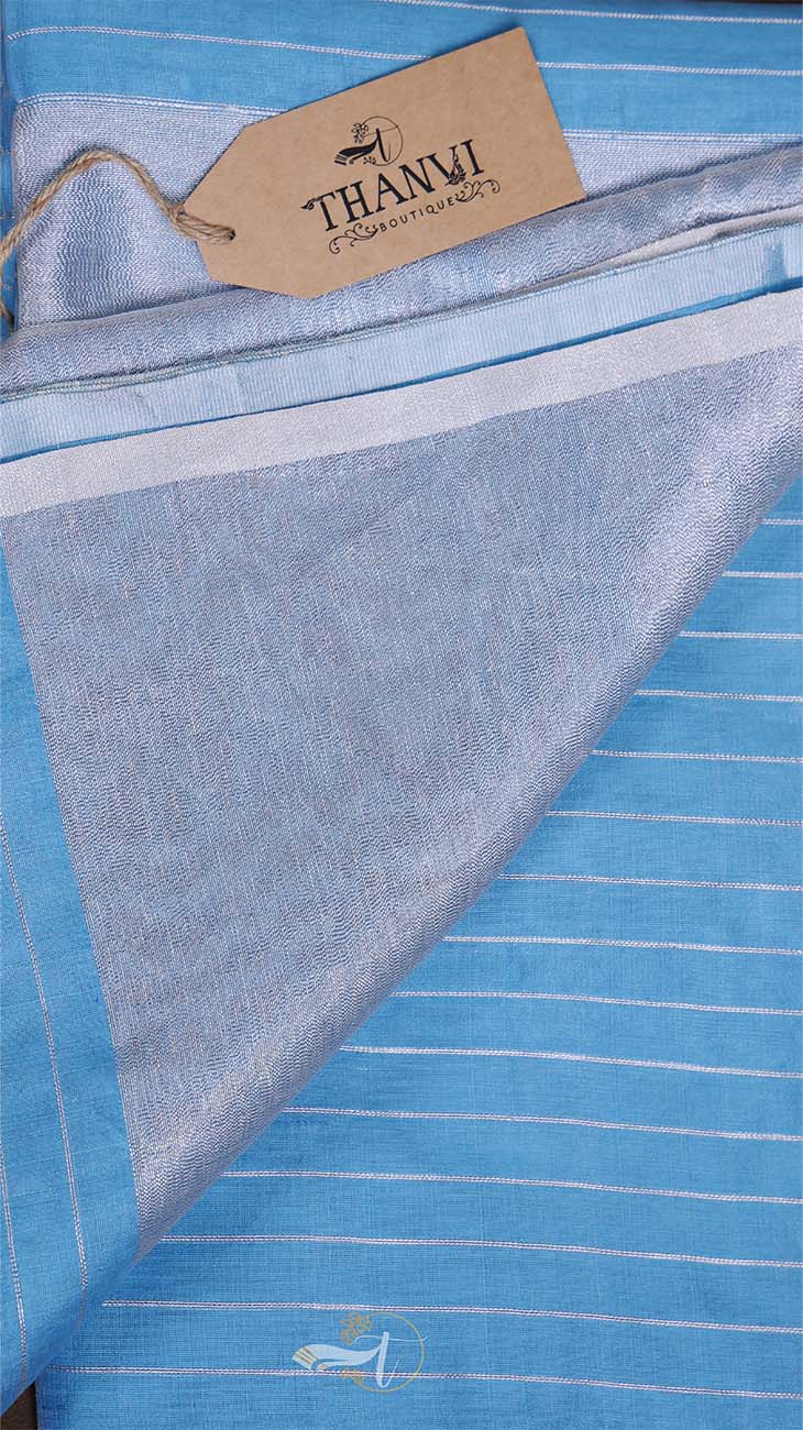 Blue fabric with white stripes and a 'Thanvi' tag on a black background