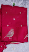 Red fabric with bird design on a light gray background