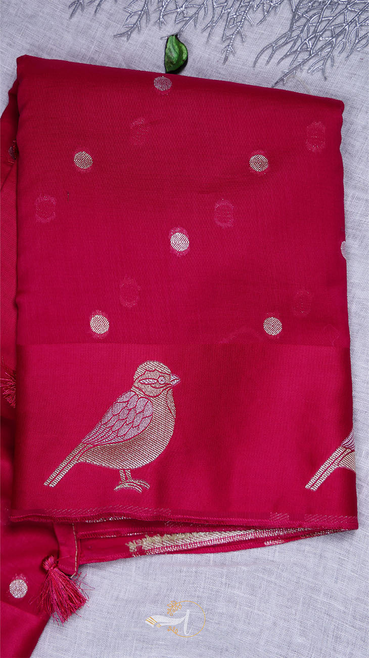 Red fabric with bird design on a light gray background