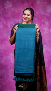 Woman holding a blue fabric against a purple background