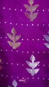 Purple fabric with floral patterns and white dots