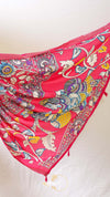 Colorful parasol with intricate patterns on a white background