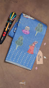 Blue fabric with artistic designs on a brown background