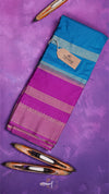 Blue and pink saree with decorative elements on a purple background