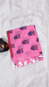 Pink towel with owl pattern on a white background