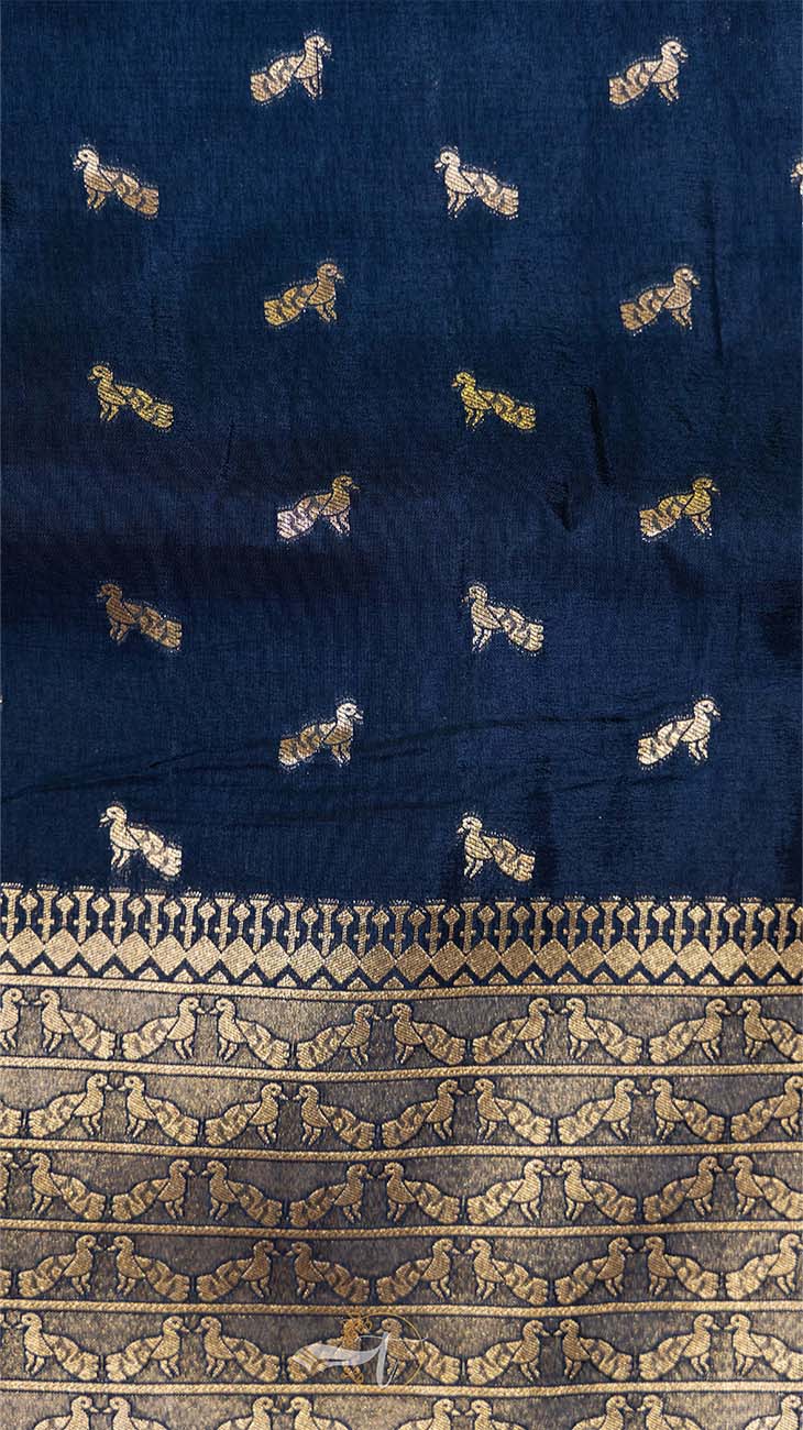 Navy fabric with gold embroidered patterns of horses and geometric designs.