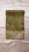 Green saree with feather pattern on a textured surface