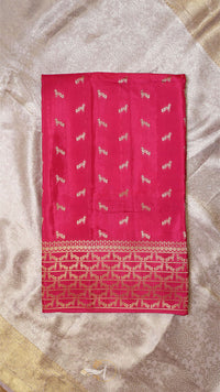 Red fabric with white patterns on a textured beige background