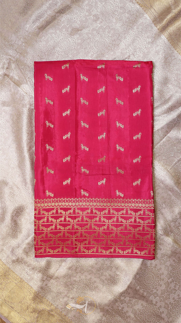 Red fabric with white patterns on a textured beige background