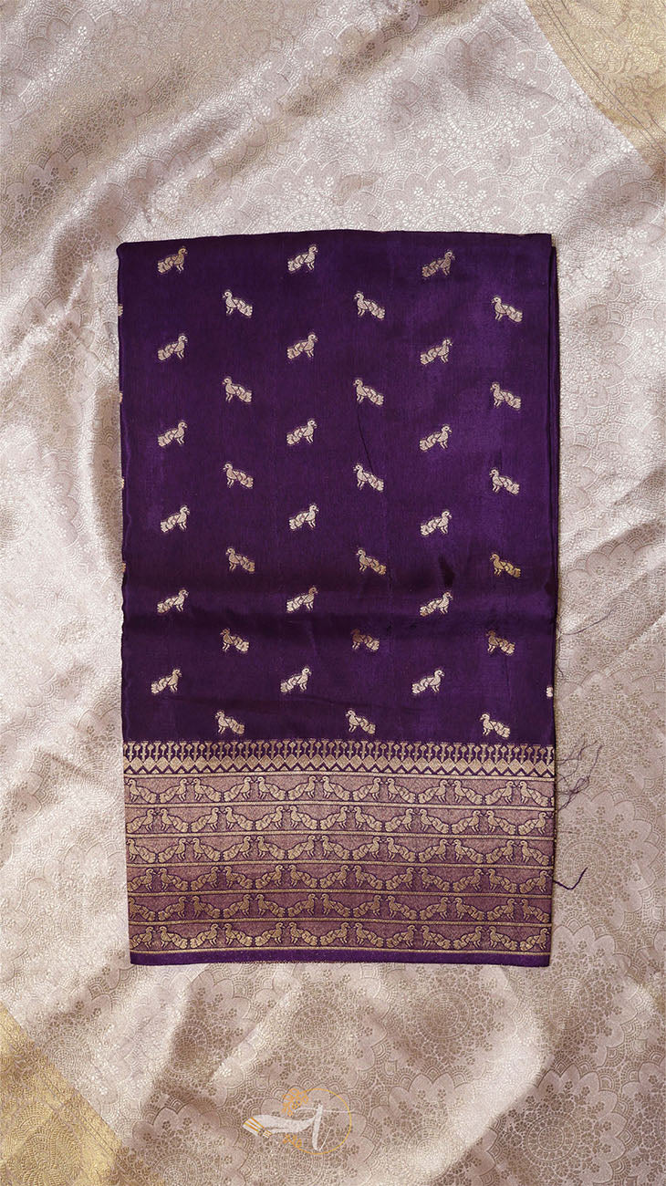 Purple fabric with white dog patterns on a beige background