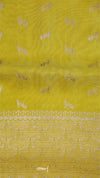 Yellow fabric with white floral patterns