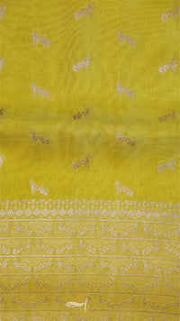 Yellow fabric with white floral patterns