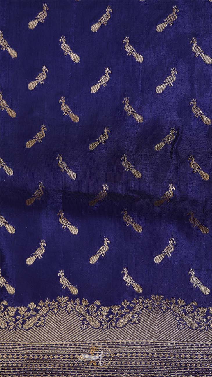Navy blue fabric with gold peacock patterns