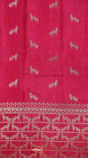 Red fabric with white horse patterns and a border