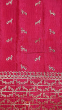 Red fabric with white horse patterns and a border