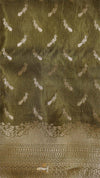 Decorative fabric with intricate patterns on a green background