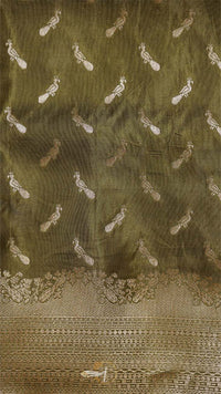 Decorative fabric with intricate patterns on a green background