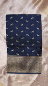 Navy blue fabric with white dog pattern on a textured beige background
